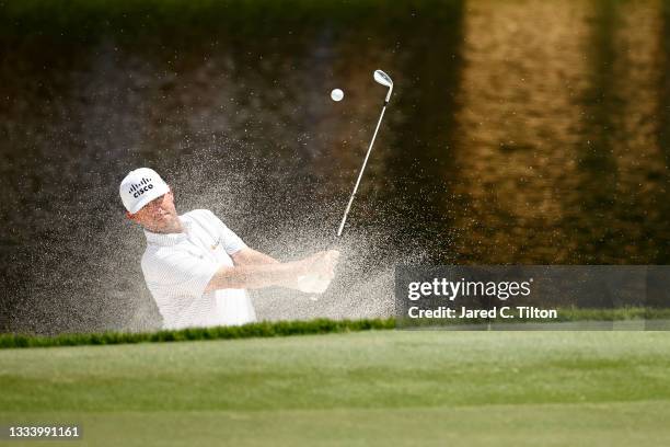 Chez Reavie of the United States plays a shot from a greenside bunker on the 15th hole during the second round of the Wyndham Championship at...