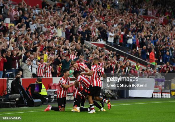 Sergi Canos of Brentford celebrates after scoring their team's first goal during the Premier League match between Brentford and Arsenal at Brentford...