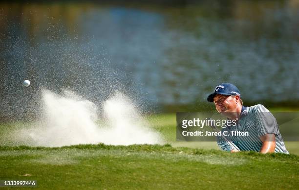 Brian Stuard of the United States plays his second shot from a greenside bunker on the 15th hole to hole out during the second round of the Wyndham...