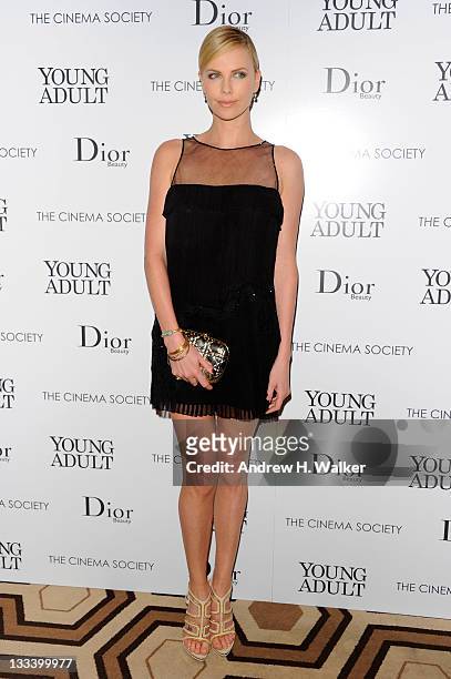 Actress Charlize Theron attends the Cinema Society & Dior Beauty screening of "Young Adult" at the Tribeca Grand Screening Room on November 18, 2011...