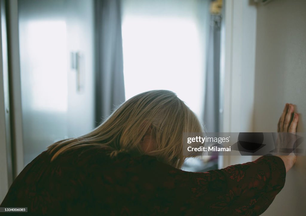 Elderly female suffering dizziness and fatigue at home
