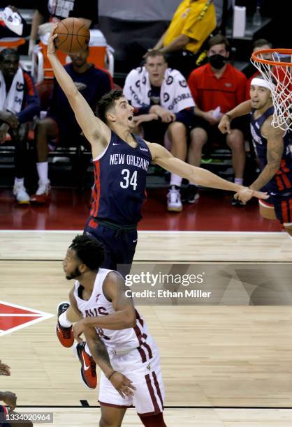 Daulton Hommes of the New Orleans Pelicans dunks against Lamar Stevens of the Cleveland Cavaliers during the 2021 NBA Summer League at the Thomas &...