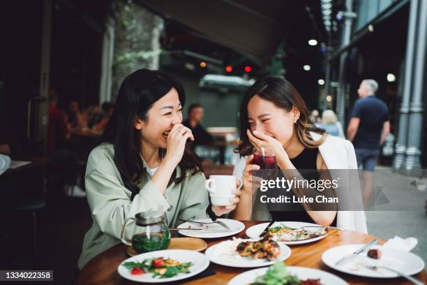 fun lunch gathering - chinese people laughing stock pictures, royalty-free photos & images