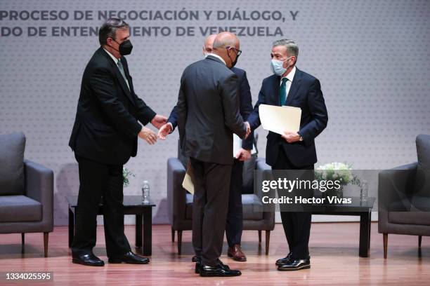 Jorge Rodriguez, President of the National Assembly of Venezuela and Gerardo Blyde Perez, Head of the opposition delegation of Venezuela shake hands...