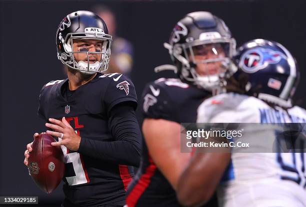 McCarron of the Atlanta Falcons looks to pass against the Tennessee Titans during the first half at Mercedes-Benz Stadium on August 13, 2021 in...