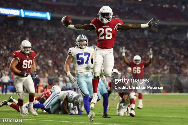 Running back Eno Benjamin of the Arizona Cardinals scores on a six-yard rushing touchdown past linebacker Luke Gifford of the Dallas Cowboys during...