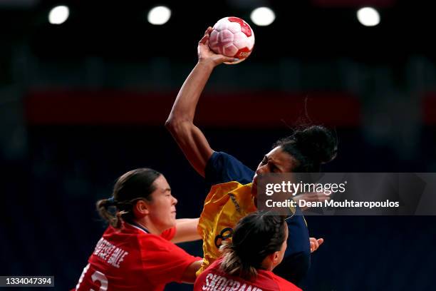 Jamina Roberts of Team Sweden shoots at goal while under pressure from Kari Brattset Dale and Stine Skogrand of Team Norway during the Women's Bronze...