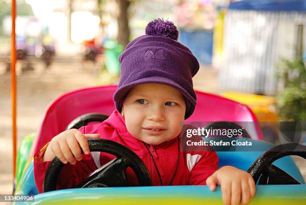 baby girl driving - macchina a pedali foto e immagini stock