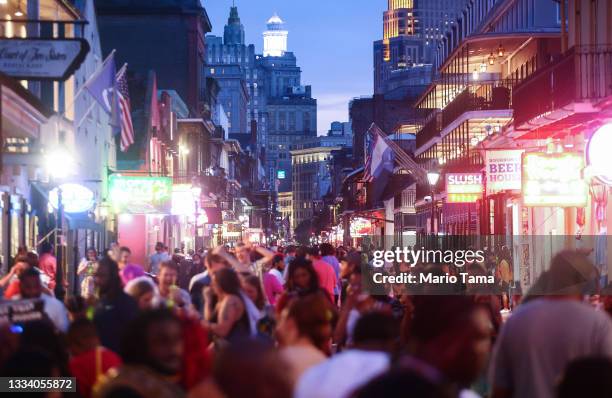 Revelers gather on Bourbon Street in the French Quarter on August 13, 2021 in New Orleans, Louisiana. Louisiana holds one of the nation’s lowest...