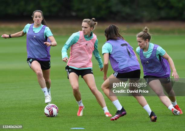Anna Patten, Vivianne Miedema and Kim Little of Arsenal during the Arsenal Women's training session at London Colney on August 13, 2021 in St Albans,...