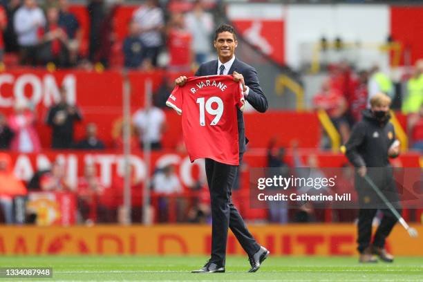 New signing, Raphael Varane of Manchester United is introduced to fans on the pitch prior to the Premier League match between Manchester United and...