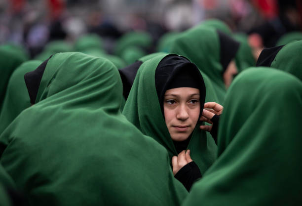 crowd of young shiite muslim women take part in a mourn ceremony during the remembrance of muharram (called asura) in halkali, istanbul - ashura stock pictures, royalty-free photos & images