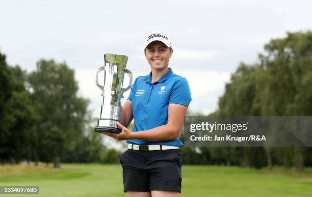 Hannah Darling of Broomieknowe poses with the trophy following victory in the R&A Girls Amateur Championship at Fulford Golf Club on August 14, 2021...