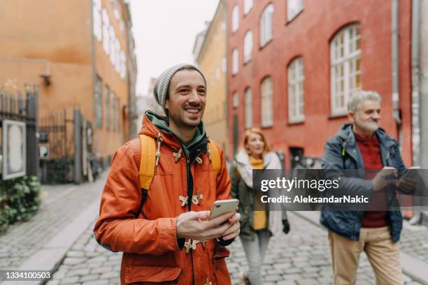 multigenerational family discovering the city - tourist group stock pictures, royalty-free photos & images