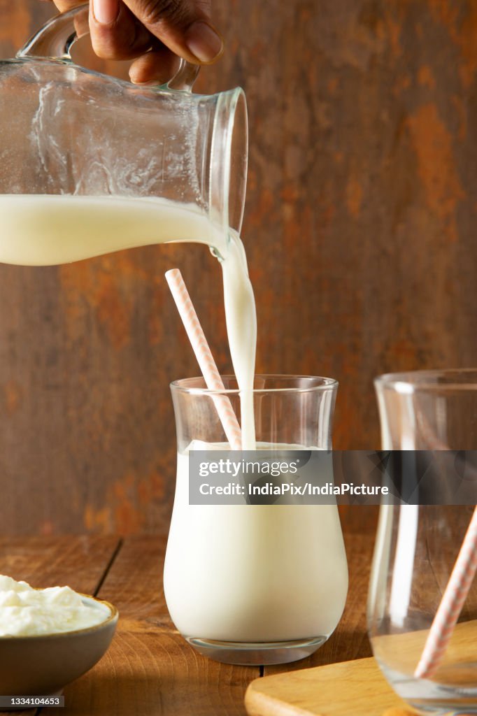Butter Milk being poured in to a glass from a jug