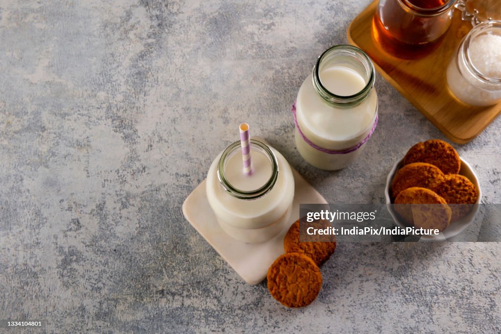 Top view of Milk and tasty cookies