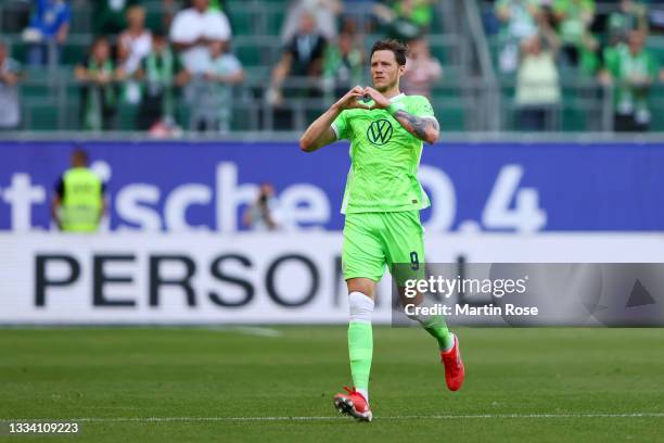 Wout Weghorst of VfL Wolfsburg celebrates after scoring their side's first goal during the Bundesliga match between VfL Wolfsburg and VfL Bochum at...