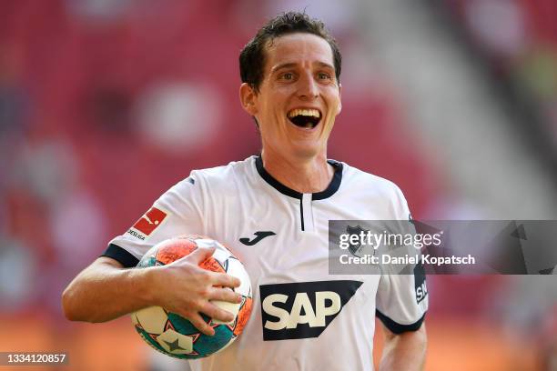 Sebastian Rudy of TSG 1899 Hoffenheim celebrates after scoring their side's fourth goal during the Bundesliga match between FC Augsburg and TSG...