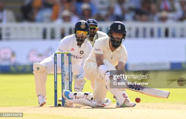 India wicketkeeper Rishabh Pant looks on as England batsman Moeen Ali hits out during day three of the Second Test Match between England and India at...