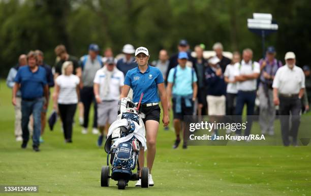 Hannah Darling of Broomieknowe walks up up to the 18th green with crowds following during the Final of the R&A Girls Amateur Championship at Fulford...