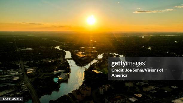 drone aerial sunset view of downtown wichita skyline, kansas features arkansas rivers and bridges - downtown wichita - fotografias e filmes do acervo