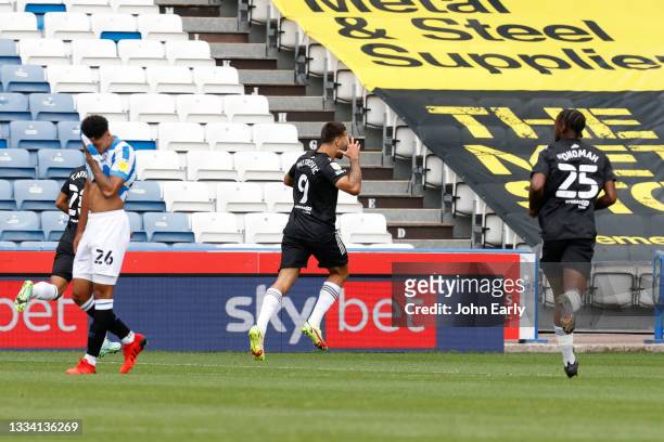 Aleksandar Mitrović celebrates opening the scoring during the Sky Bet Championship match between Huddersfield Town and Fulham at Kirklees Stadium on...
