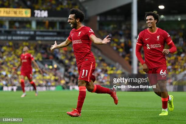 Mohamed Salah of Liverpool celebrates after scoring their side's third goal during the Premier League match between Norwich City and Liverpool at...