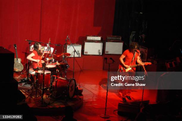 American Alternative Rock musicians Meg White , in drums, and Jack White, on guitar, both of the White Stripes, as they perform onstage at Irving...