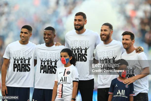 New signings, Achraf Hakimi, Georginio Wijnaldum, Gianluigi Donnarumma, Sergio Ramos and Lionel Messi of Paris Saint-Germain pose for a photo as they...