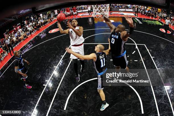 Jarrett Jack of the Trilogy attempts a shot while being guarded by Dusan Bulut and Glen Davis of the Power during BIG3 - Week Seven at the Orleans...