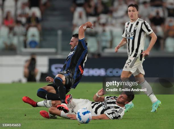 Jose Palomino of Atalanta BC is challenged by Rodrigo Bentancur of Juventus during the pre-season friendly match between Juventus and Atalanta BC at...