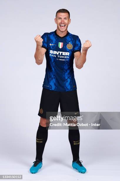 Edin Dzeko of FC Internazionale poses for a photo during his unveiling as new FC Internazionale signing at Appiano Gentile on August 11, 2021 in...