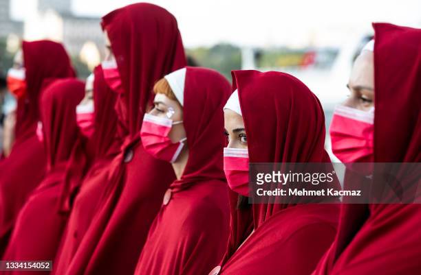 Members of Turkish women's group Kampus Cadiari wear costumes from the TV series "The Handmaid's Tale" during a protest against Turkey's withdrawal...