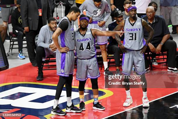 Chris Johnson, Stefhon Hannah, and Ricky Davis of the Ghost Ballers meet during the game against the Triplets during BIG3 - Week Seven at the Orleans...