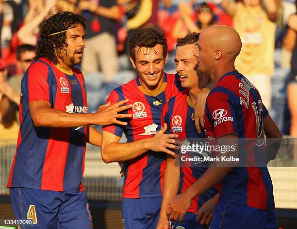 Nikolai Topor-Stanley, Ben Kantarovski, Ryan Griffiths and Ruben Zadkovich of the Jets celebrate after Griffiths scored a goal during the round seven...