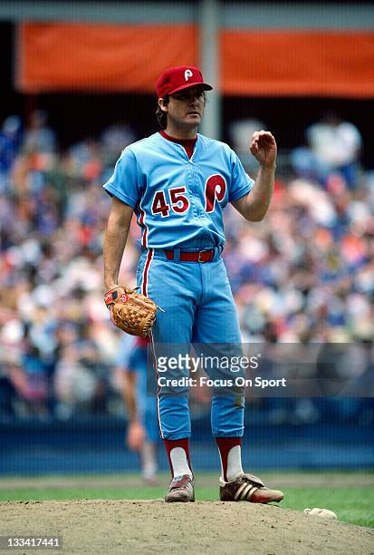 Pitcher Tug McGraw of the Philadelphia Phillies looks over to first base from the mound against the New York Mets during an Major League Baseball...