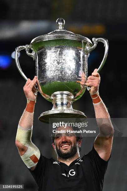 Samuel Whitelock of the All Blacks holds up the Bledisloe Cup after winning The Rugby Championship and Bledisloe Cup match between the New Zealand...