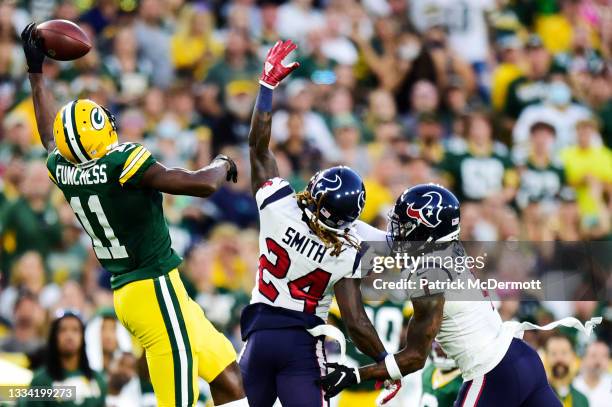 Devin Funchess of the Green Bay Packers is unable to catch a pass against the Houston Texans in the first half during the preseason game at Lambeau...