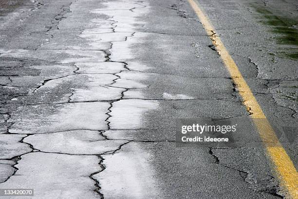 wet and cracked - bumpy road stock pictures, royalty-free photos & images