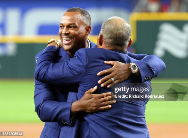 Former Texas Rangers third baseman Adrian Beltre hugs Ivan Rodriguez after being inducted into the Texas Rangers Hall of Fame at Globe Life Field on...