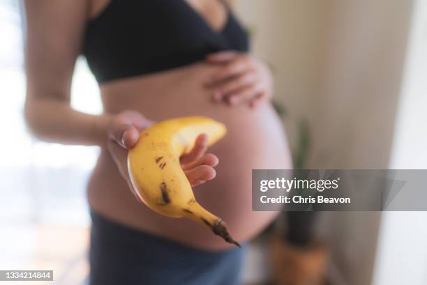 pregnancy - banana woman stock pictures, royalty-free photos & images