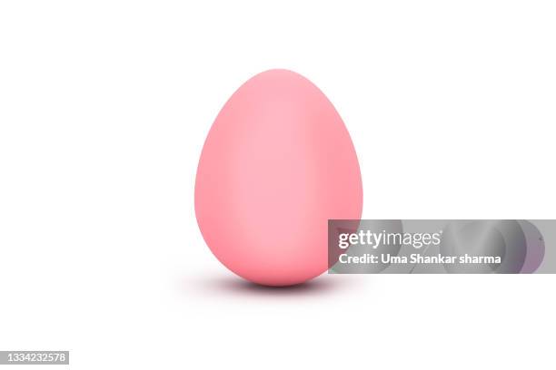 pink egg against white background. a computer generated image of egg. - easter egg stock-fotos und bilder