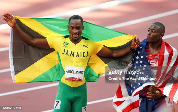 Hansle Parchment of Team Jamaica and Grant Holloway of Team United States celebrate the gold and silver respectively after competing in the Men's...