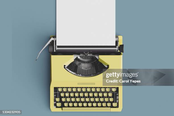 top view old yellow pastel typewriter with blank paper,template - macchina da scrivere foto e immagini stock