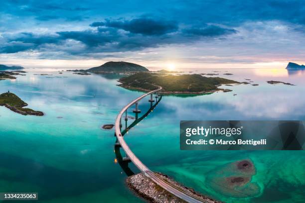 bridge to sommaroy and midnight sun, tromso, norway - awe stock pictures, royalty-free photos & images