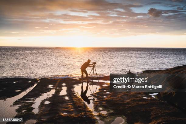 photographer at work along the coast, norway - photographer seascape stock pictures, royalty-free photos & images