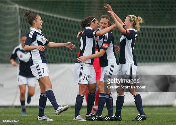 Jodie Taylor of the Victory is congratulated by her team mates after scoring a goal during the round five W-League between the Melbourne Victory and...