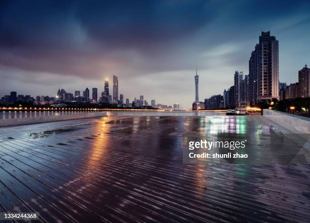 wooden platform in the city after the rain - cityscape stock pictures, royalty-free photos & images