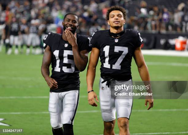 Wide receivers John Brown and Willie Snead of the Las Vegas Raiders talk as they walk off the field after the team's 20-7 victory over the Seattle...