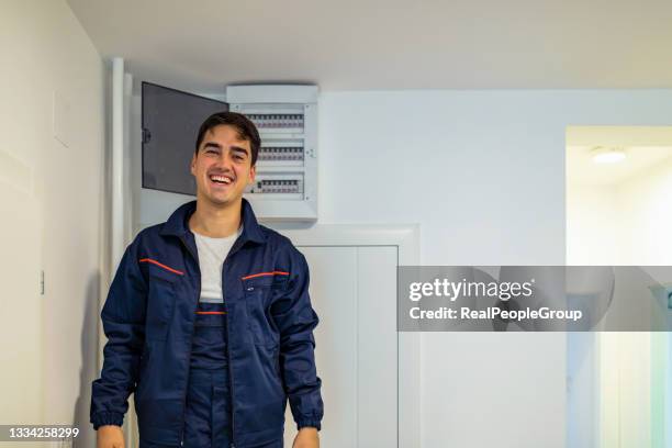 electric residential fuses box check by caucasian electrician. - fuse box stockfoto's en -beelden